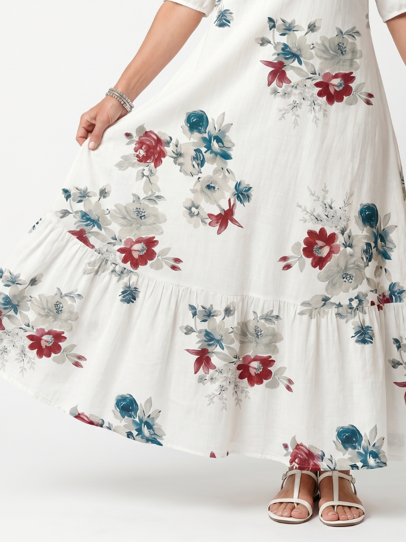 Élina | Blommig midiklänning med tofsar