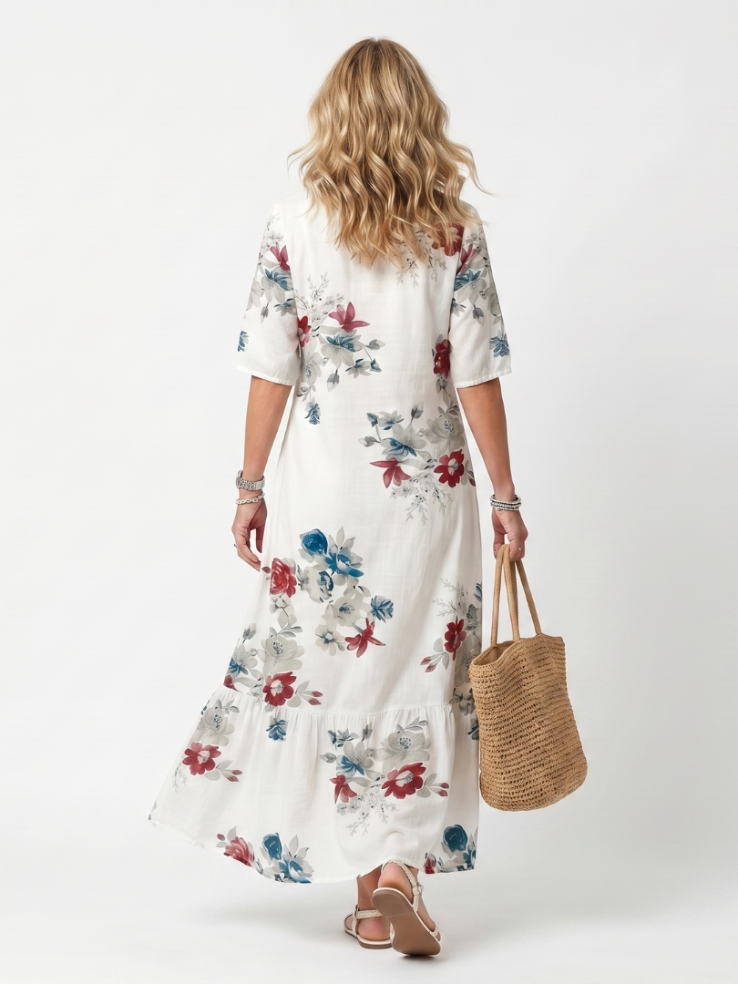 Élina | Blommig midiklänning med tofsar