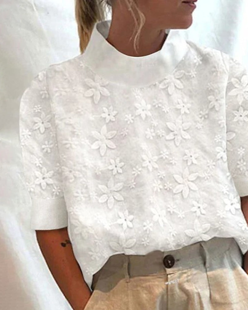 Carla | Blus med broderad ståkrage
