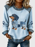 Nuria – tröja med taxmotiv och patchwork i denim